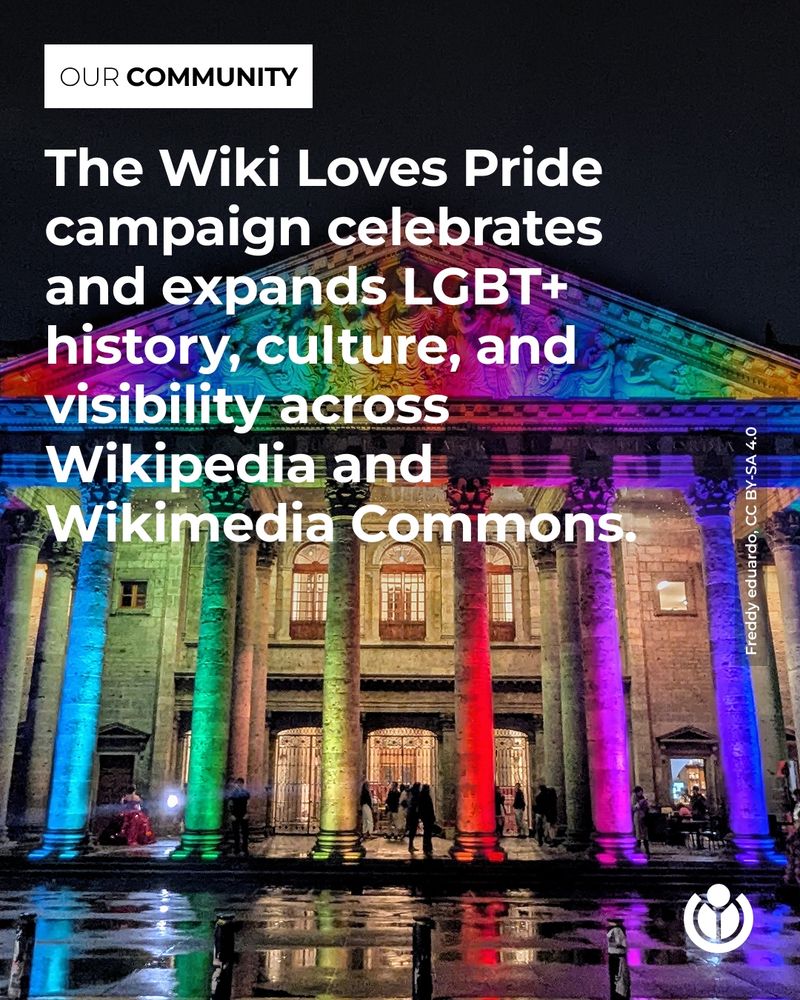 A neoclassical building lit up in rainbow colors at night. Overlaid text reads: “The Wiki Loves Pride campaign celebrates and expands LGBT+ history, culture, and visibility across Wikipedia and Wikimedia Commons.”