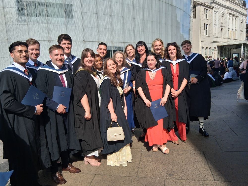 A group of students in graduation gowns
