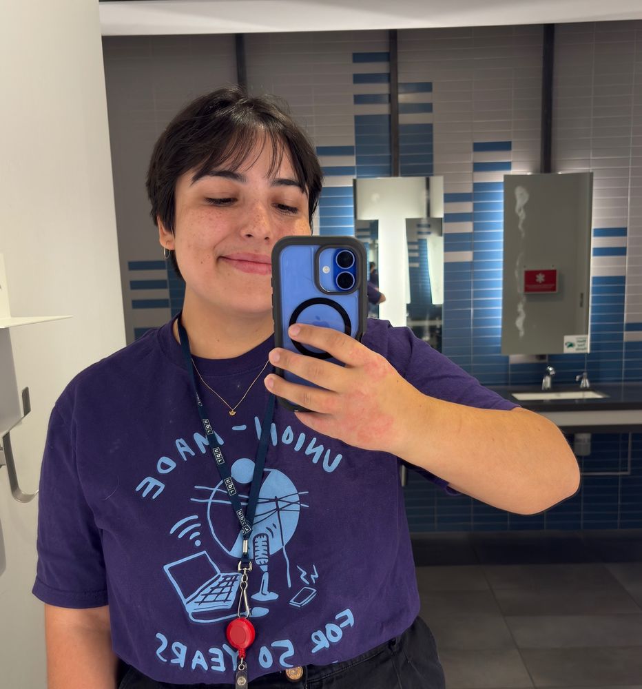 Natalie wearing a purple SAG-AFTRA tshirt that says “union made for 50 years”