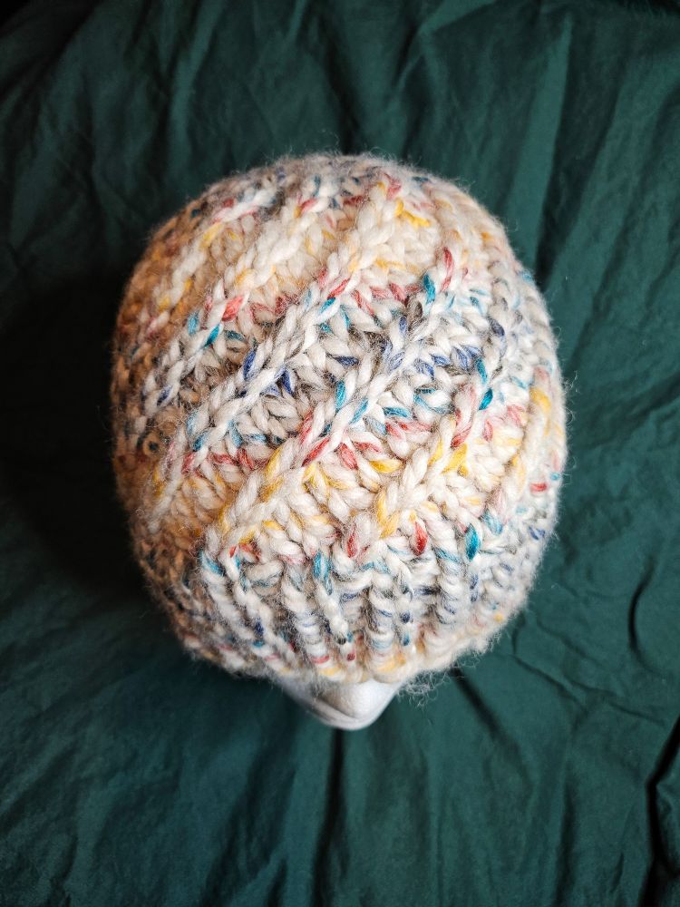 Knit hat with raised spiral motif