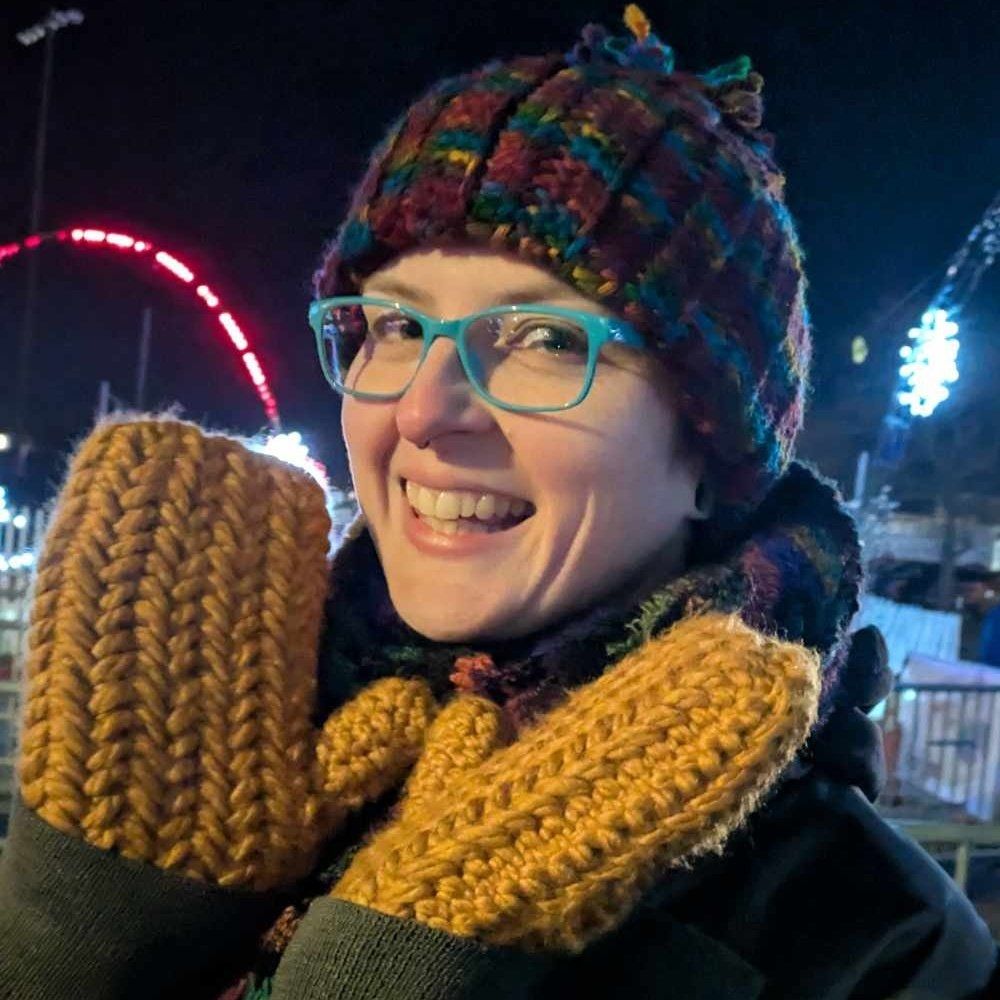 Crocheted beanie and crocheted mittens keeping Flux very warm and happy