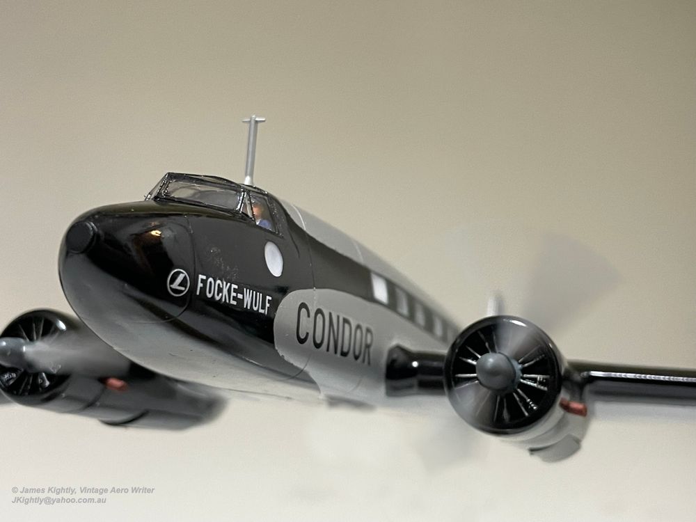 Close up photo of a model aircraft, with the propellers going around. Text on the aircraft reads 'Focke Wulf Condor'. Photo and model by James Kightly.