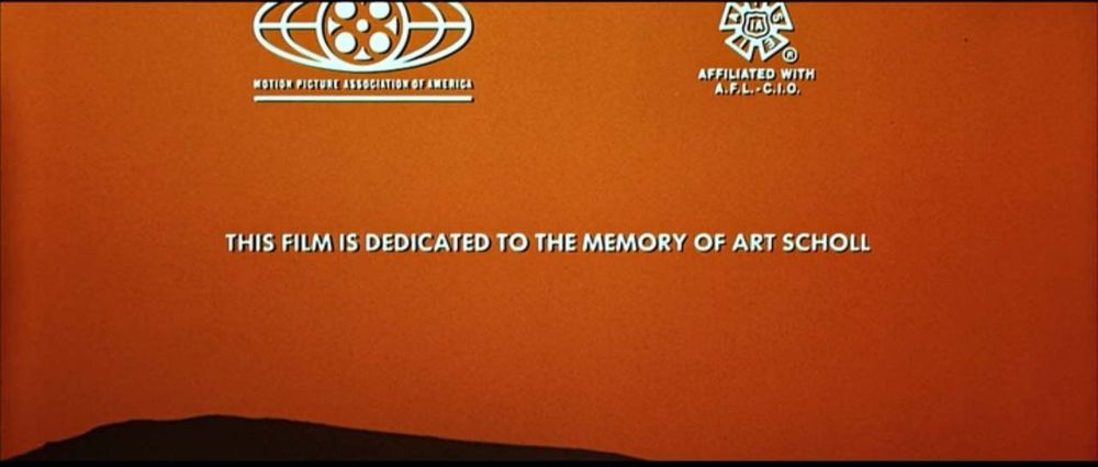 A screenshot from the end of the Top Gun film, reading: "This film is dedicated to the memory of Art Scholl'.