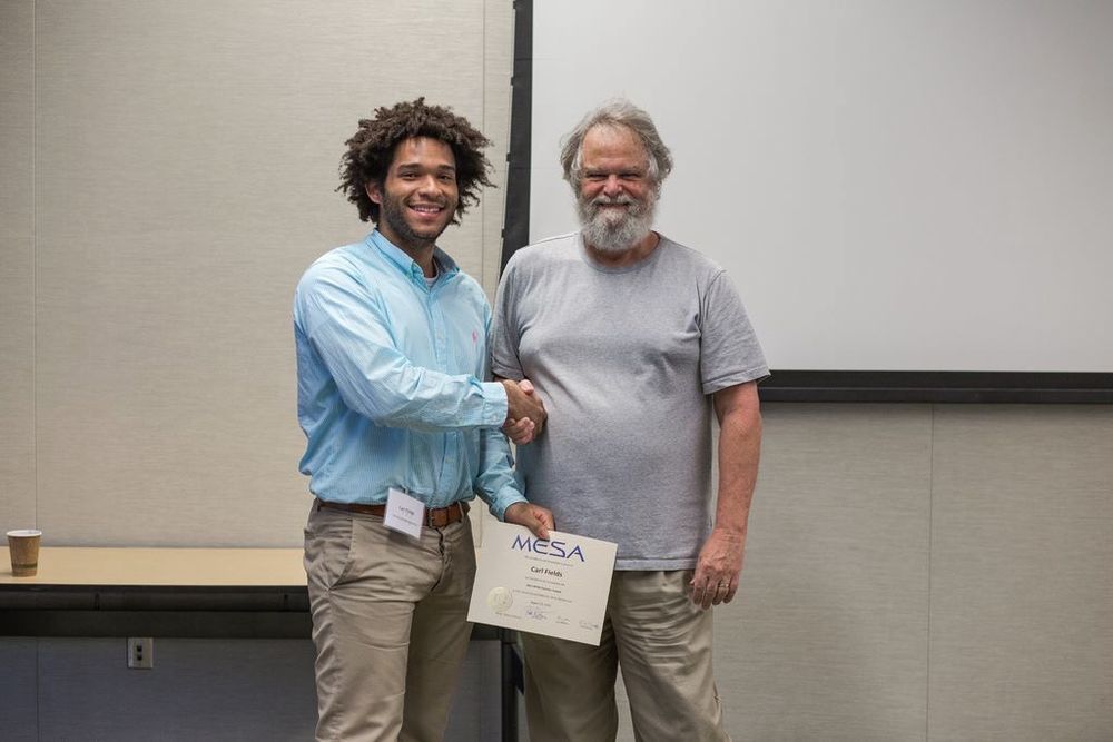 graduating from the mesa summer school. carl fields pictured with mesa creator bill paxton. 