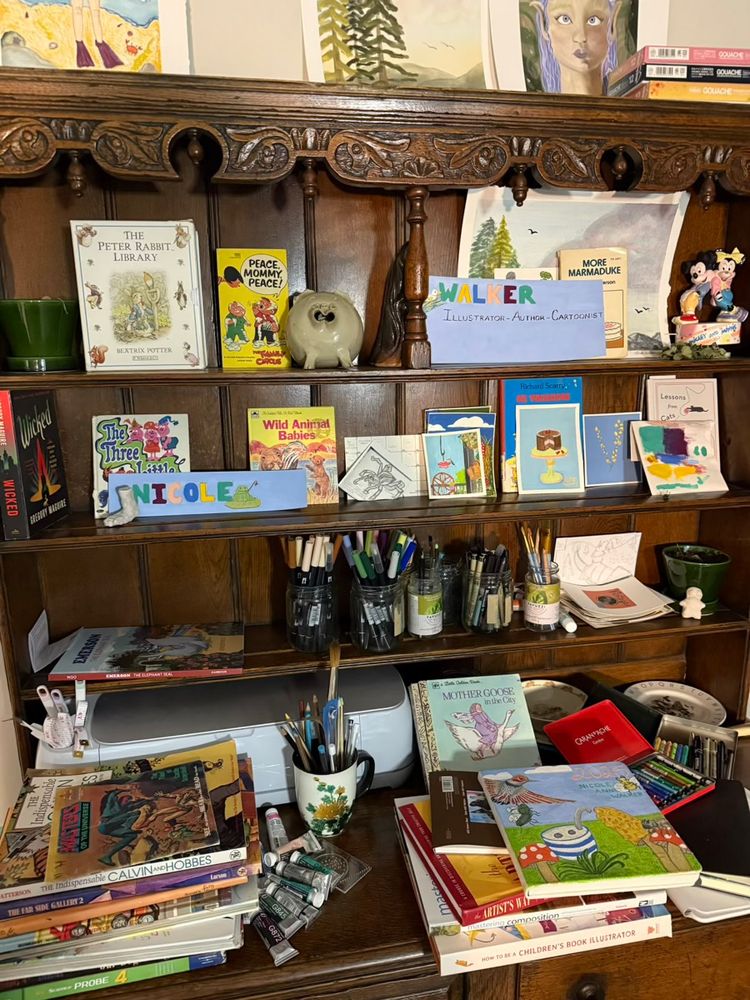 Trip planning for PYI2025 conference in Toronto hosted by CANSCAIP.

A picture of Nicole’s grandparents then dining now Nicole’s studio hutch covered in books, art supplies and artwork and trinkets by Nicole and her family that is rotated but somethings always remain. 