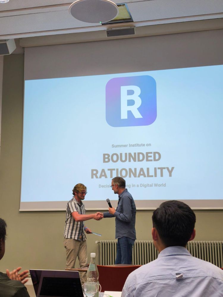 Ian winning 2nd place in the Bounded Rationality Summer Institute Poster Competition