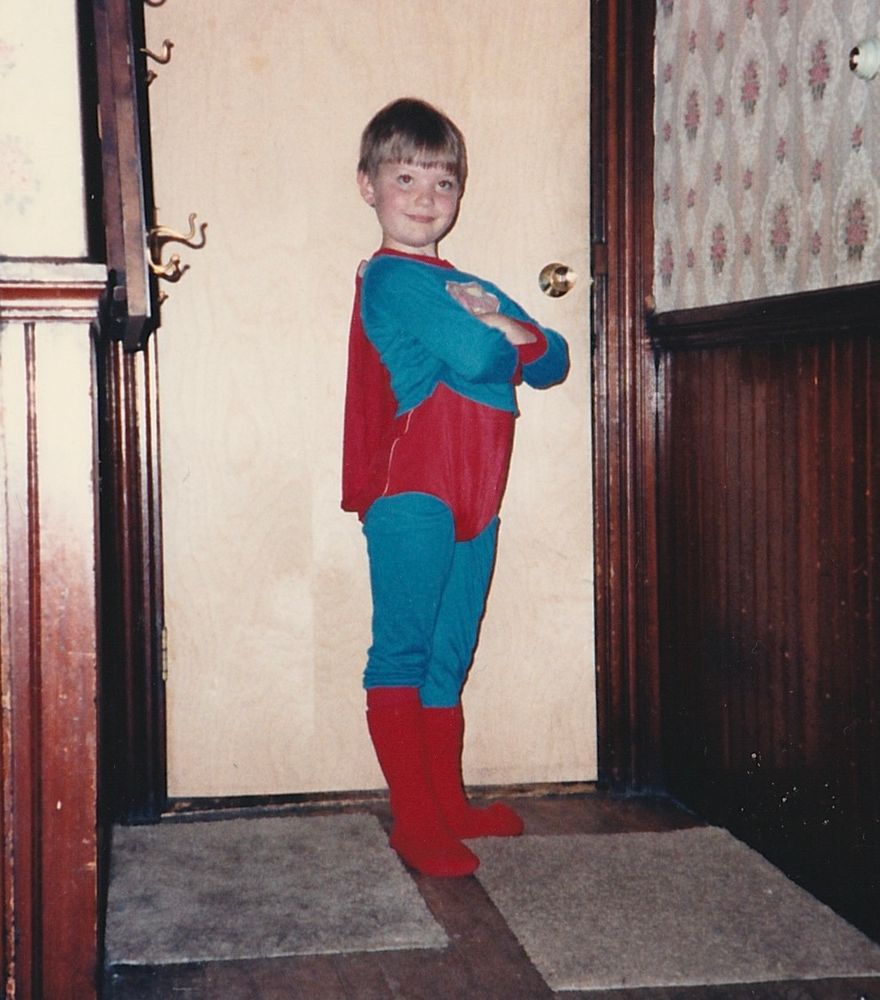 Me at age 7 wearing a Superman outfit (pajamas?) with an appropriate pose
