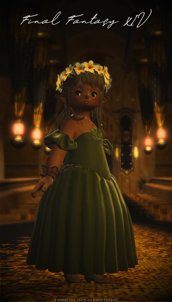 Mitan stands in surprise at something the viewer has to say. 

She wears a white crown of plumeria flowers over her long hair, thin metal frames, a thin golden necklace with a teardrop gem, a leaf green ballgown with puff sleeves and a lighter green rosette at the chest, mesh gloves with a matching green ribbon on the wrists, and flesh tone brown boots with green clasps. 

The copyright messages for FFXIV are visible at the top in cursive and the the bottom in print, both in white. 