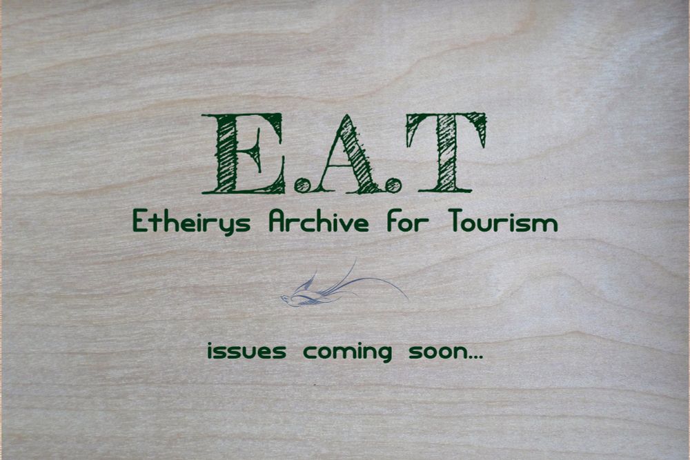 A new magazine title announcement from, typed over pale wood grain: 

"E.A.T 
Etheirys Archive for Tourism"
An image of a blue bird with long tail feathers flying left
"issues coming soon..."