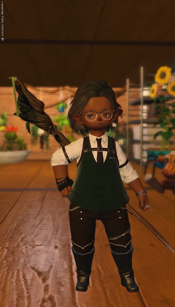 A Plainsfolk Lalafellin man posed in front of an indoor loft garden. 
He wears tortoise shell and silver frames over deep freckles, a white button-down top and green vest with a black tie and black leather holster, a half-glove on one hand, silver chain bracelets on the opposite hand, deep green painted nails, a silver pearl ring, deep brown bottoms adorned with silver, a silver garter, and black leather Starlight boots with a decoration of silver stars. He has a black mage's staff upon his back. 

Copyright message, as is standard, is visible on the upper left from being taken in portrait mode. 