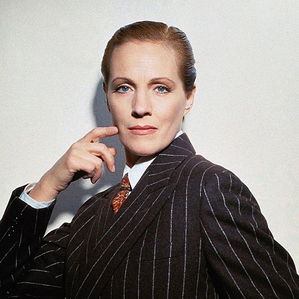 Julie Andrews as Victor(ia) in Victor/Victoria - Julie dressed in a pinstriped black suit with red tie, , her hair slicked back.