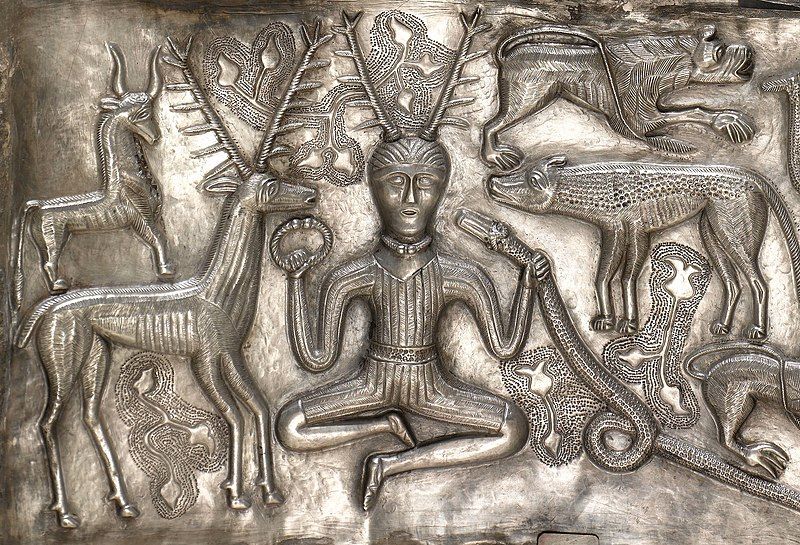 The Gundestapp Cauldron, showing Cernunnos holding a torc in one hand and a snake in the other, surrounded by peaceful animals.