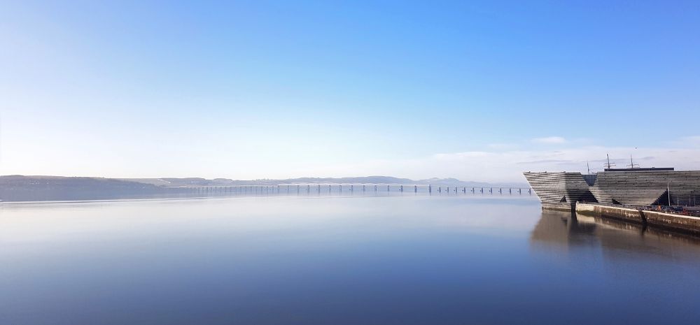 Am image of the River Tay, blue skies looking onto V&A Dundee.