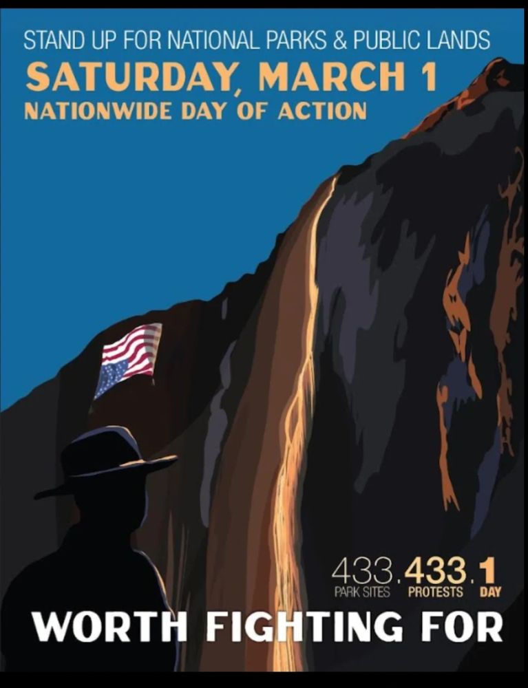 A poster with an illustration of a ranger looking up at a glowing waterfall, with an upside down flag hung high up on the walls. The poster says "Worth Fighting For" and calls for protests in all of the national park sites on March 1. 