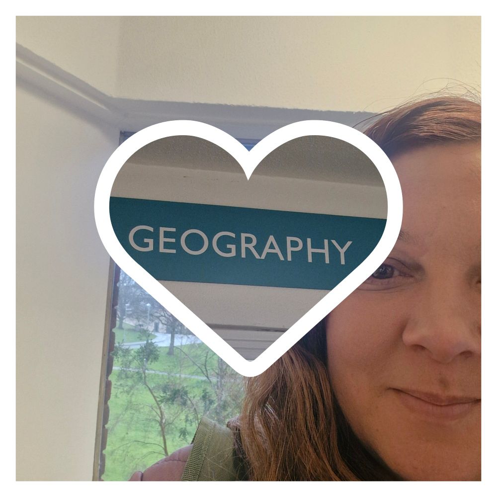 A selfie of Helena with the Geography department sign 