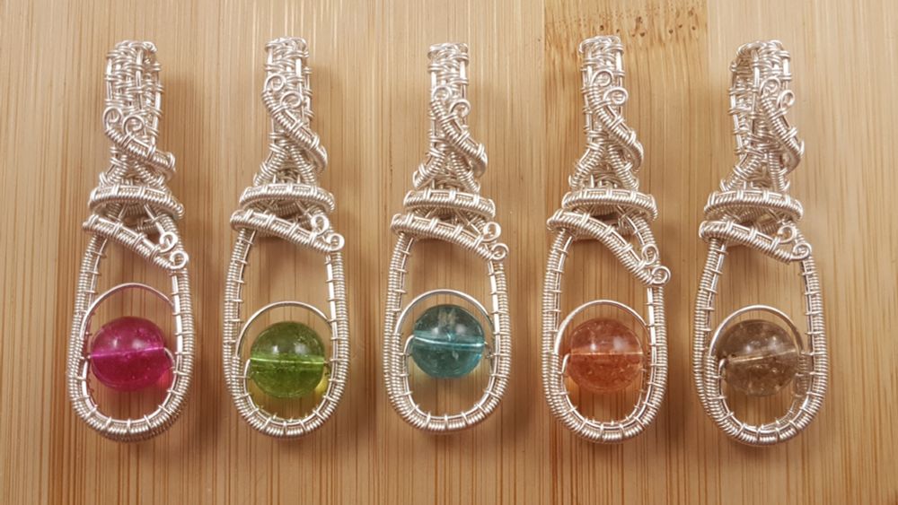 5 single bead and silver wire fidget pendants - pink, green, blue, orange, brown. 