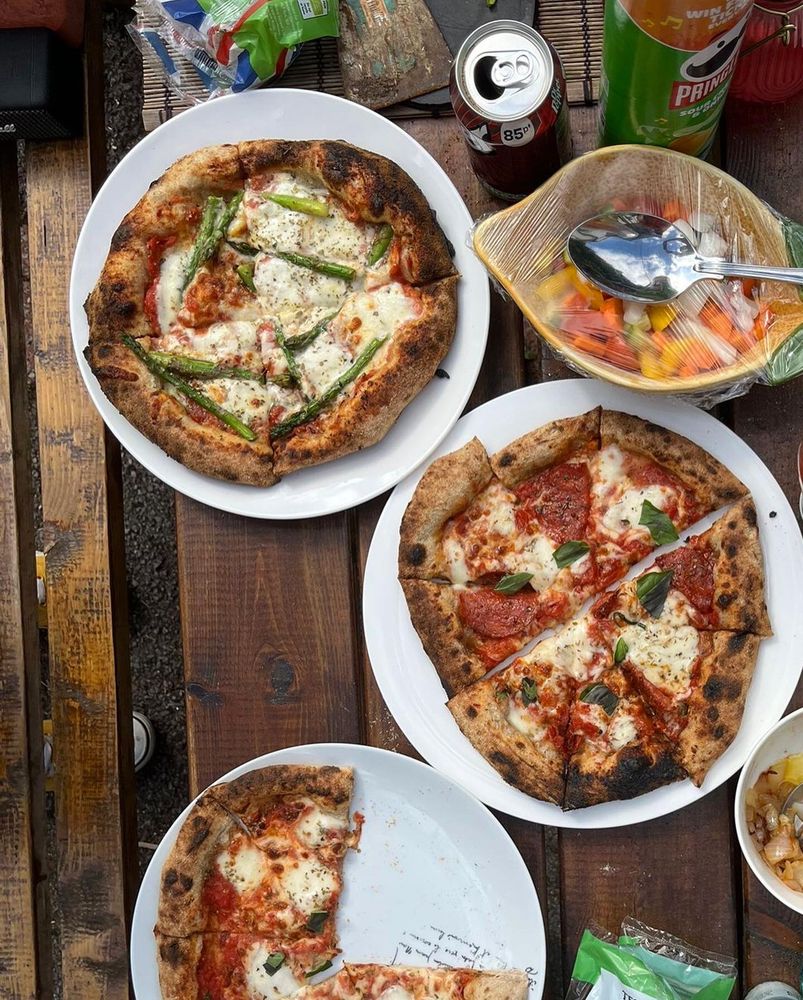 Margarita, Pepperoni and Asparagus pizzas.