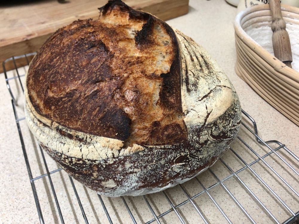 Freshly baked sourdough loaf (another angle).
