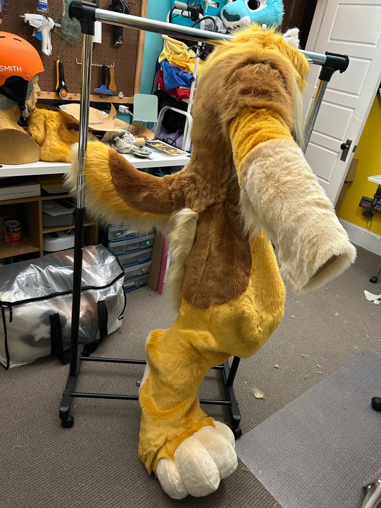 a half completed fursuit body on a duct tape dummy 