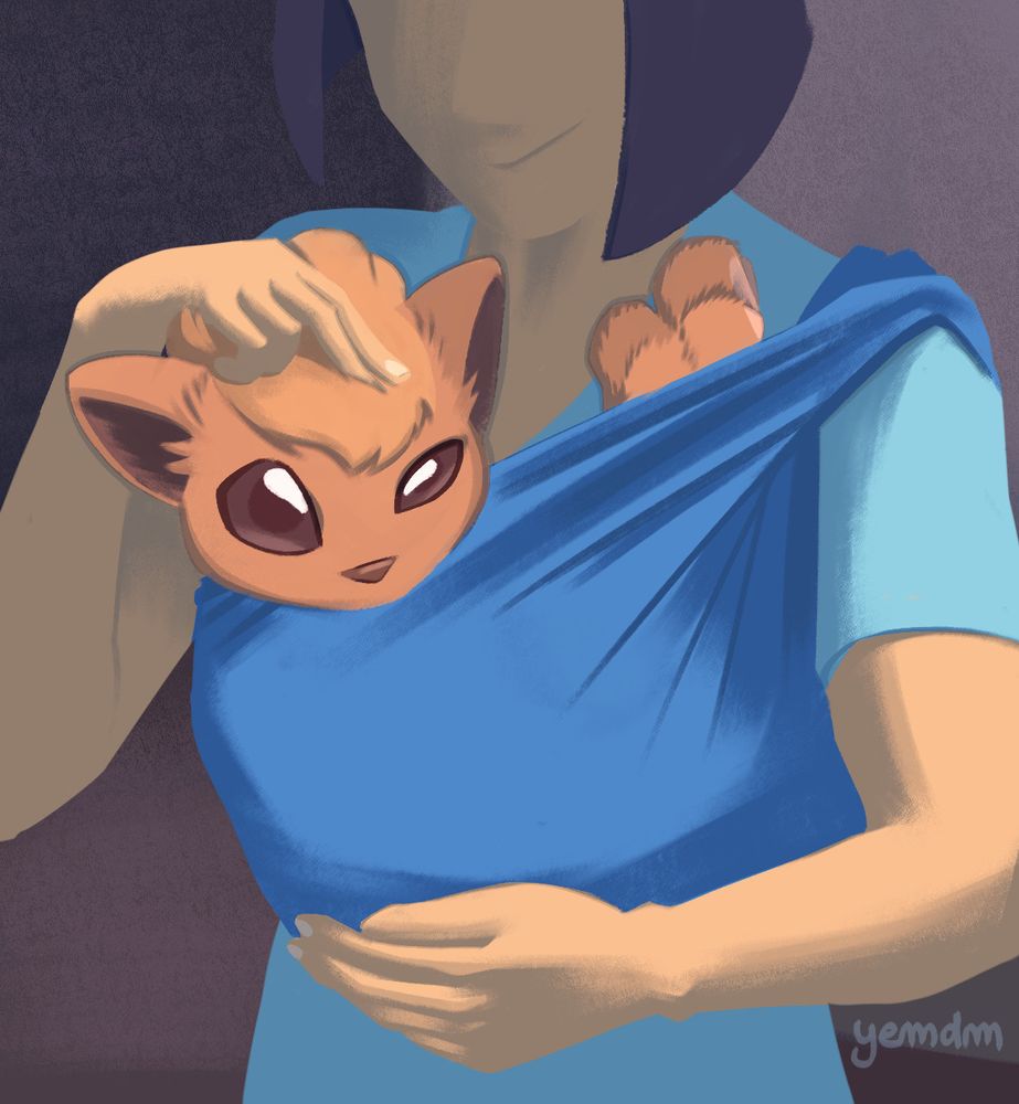 A Vulpix (foxlike Pokemon) is held in a baby sling against the chest of its trainer.