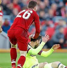 Andy Robertson ruffling Barcelona’s Messi’s hair during the mighty reds 4-0 pasting of the Blaugrana at Anfield