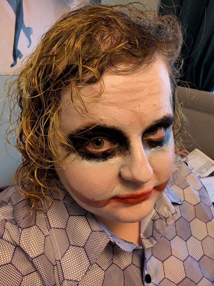Selfie of fat dumpy woman with painfully British physiognomy in heath ledger joker makeup