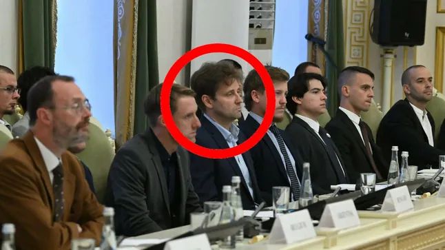 German AFD politicians Robert Risch sitting among fellow neo-Nazis at a conference table in the MArinskii Theatre in St. Petersburg, Russia