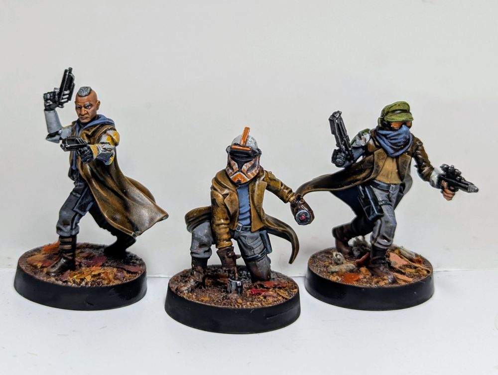 Three sleeper cell miniatures by Atomic Mass Games kitbashed with clone armour parts. 