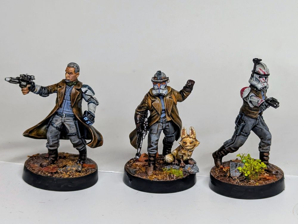 Three sleeper cell miniatures by Atomic Mass Games kitbashed with clone armour parts. 