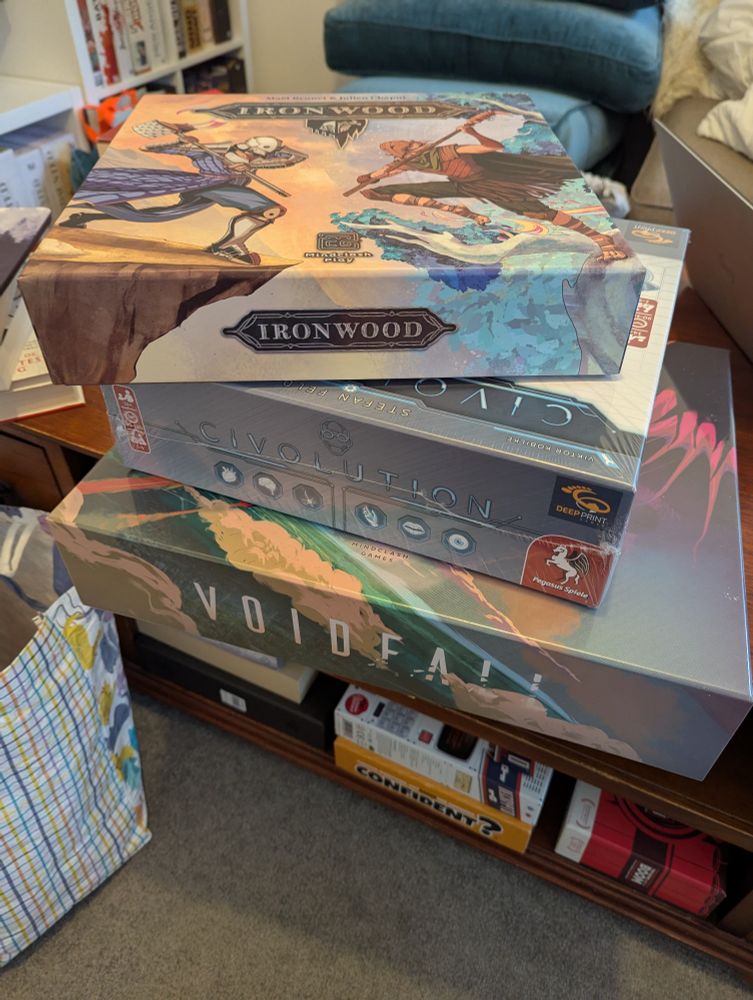 Stack of board games 
Ironwood
Civolution 
Voidfall