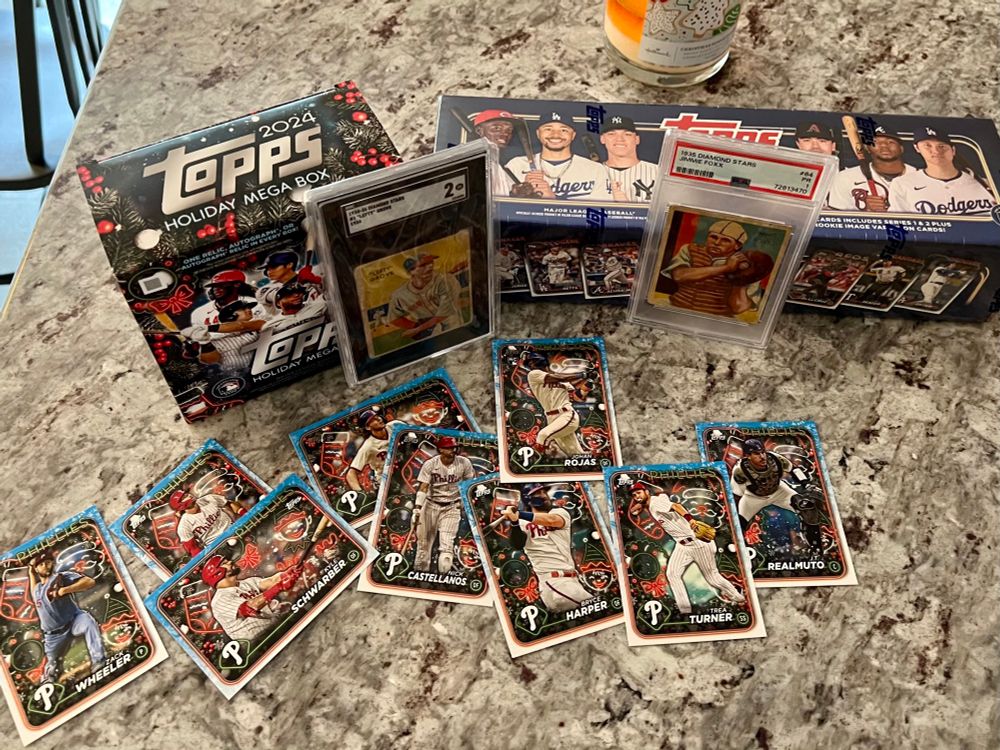 Baseball cards delivered on Christmas morning, including a 2024 Topps factory set, 1935 Diamond Star cards and Phillies cards from a 2024 Topps Holiday Mega Box.
