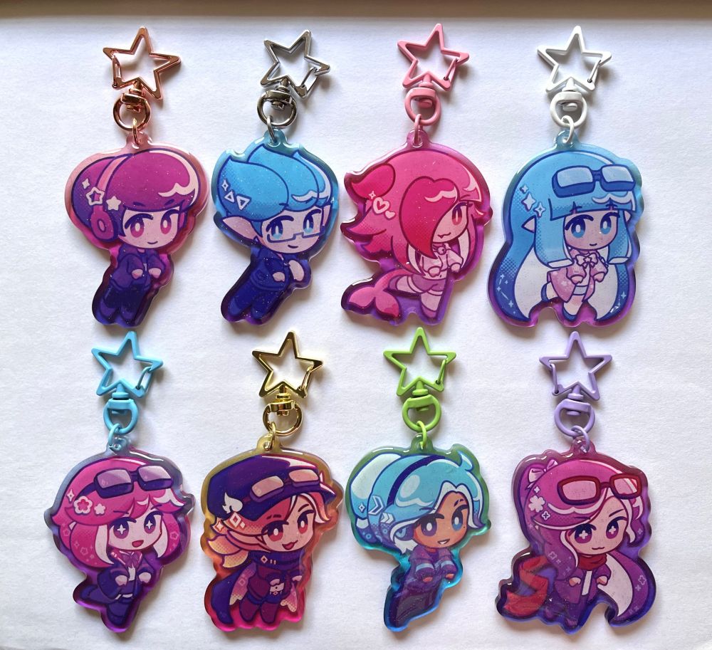 8 colorful gradient acrylic charms with star clasps, all of splatoon player characters. yay!