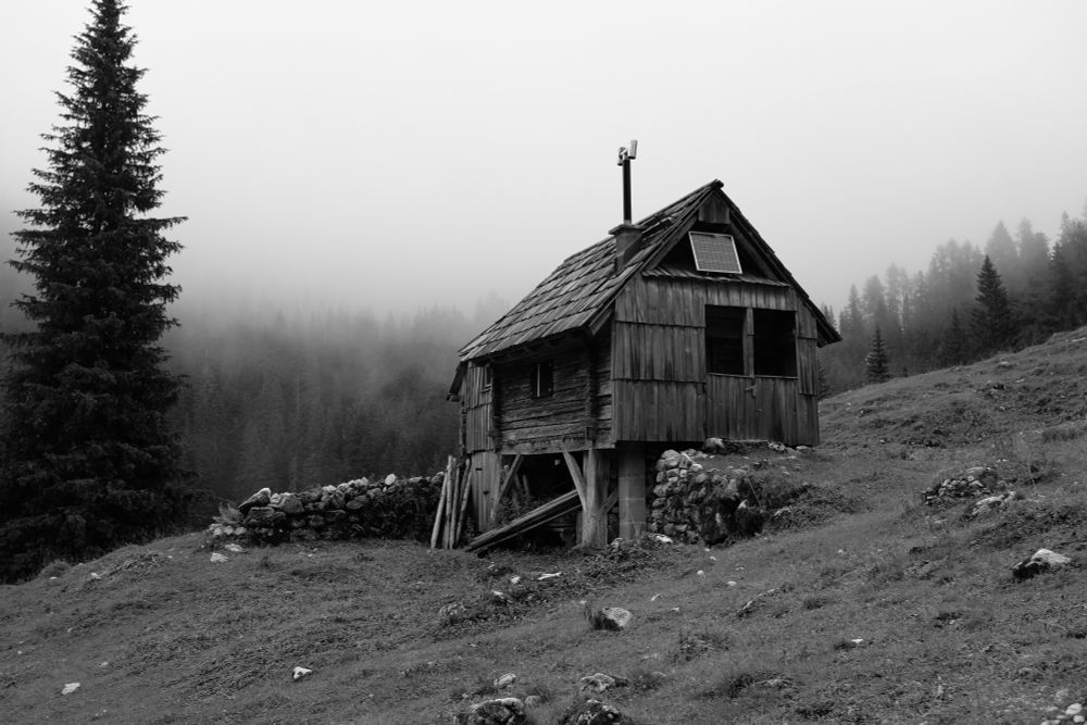 23mm black and white photograph of a hut in the triglav national park
