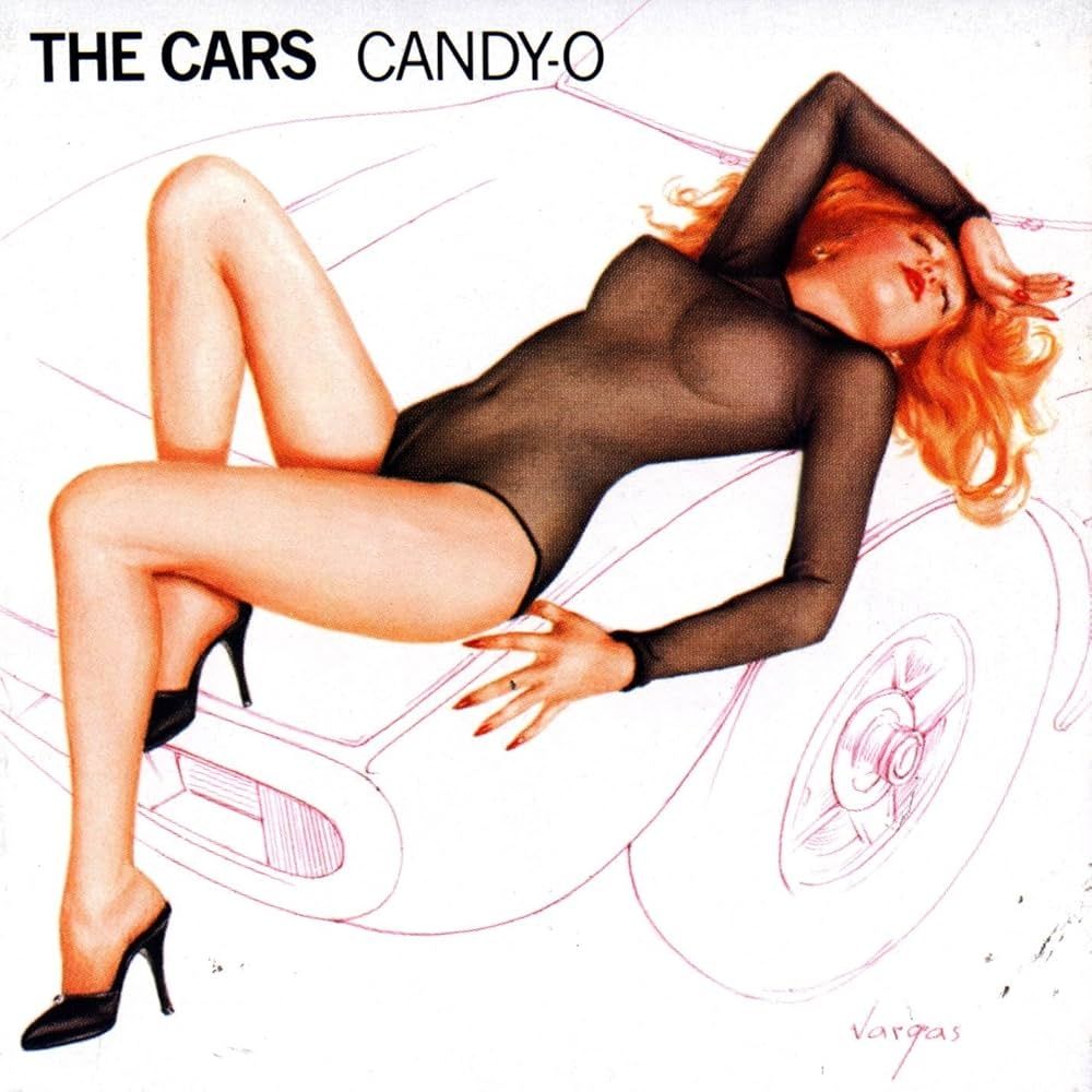 Album cover of The Cars 2nd album "Candy - O"
A painting by the artist Vargas of a shapely red haired lady laying on the hood of a car.