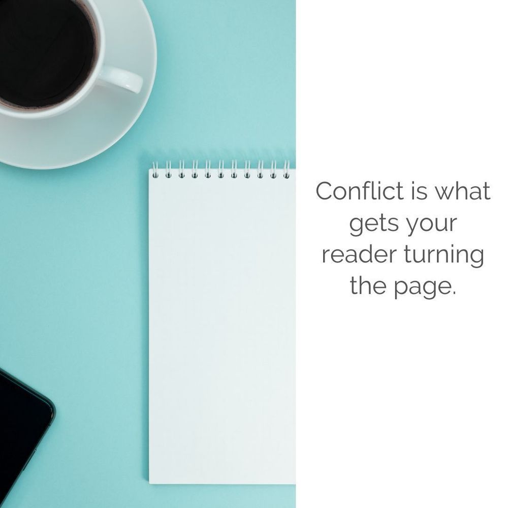 teal desk background with note pad and white cup with coffee in it