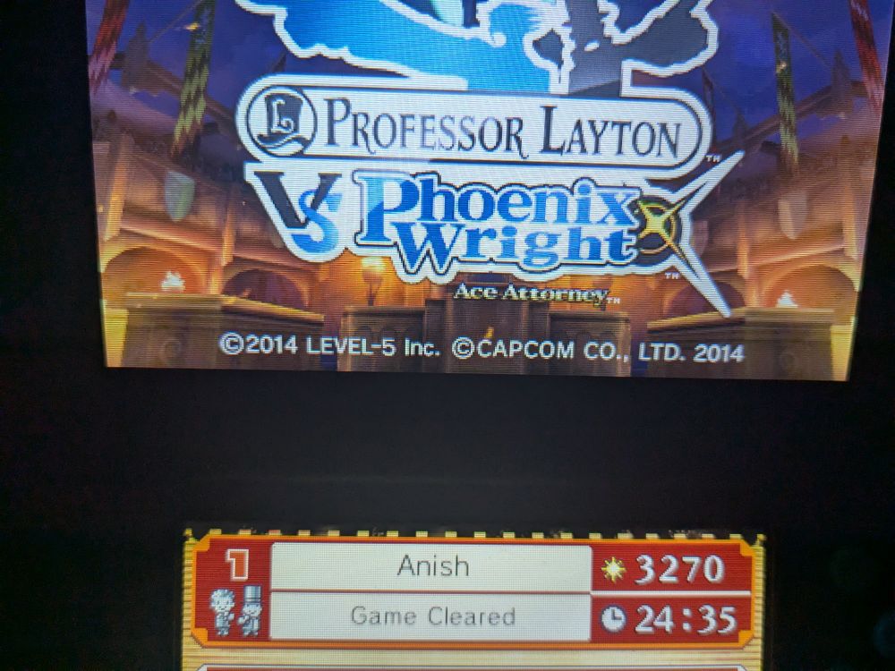 Screenshot of Professor Layton vs Phoenix Wright : Ace Attorney's main menu showing that my save now says "Game Cleared".