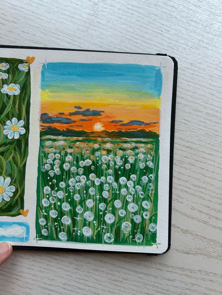 vertical landscape sketch of a grass field with white dandelions. the field takes up a little over half of the landscape. above the field there’s the sky with clouds and a setting sun visable. the sky goes from blue to yellow to orange. the sketch is done in acrylic markers, the colours are vibrant. 