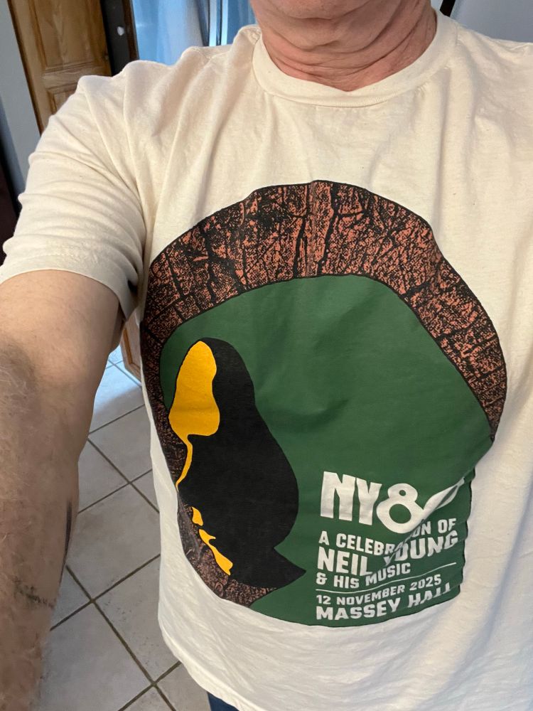 Tshirt that has a silhouette of Neil Young’s face and a logo that says NY80 and Massey Hall
