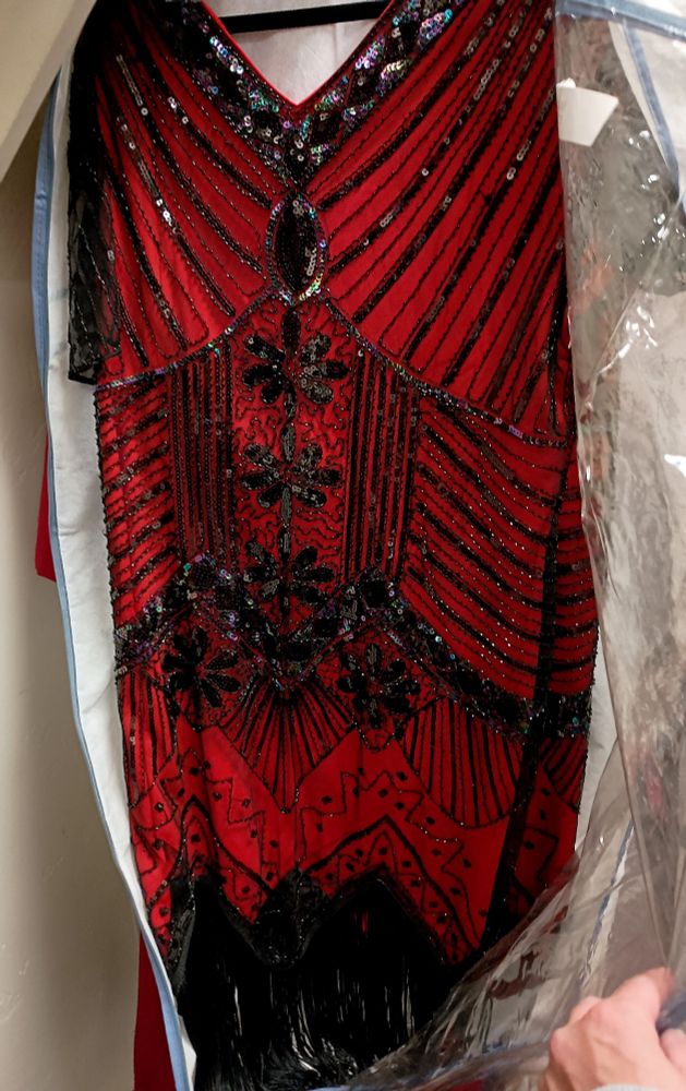 Vintage red and black dress with sequins and fringe at the bottom