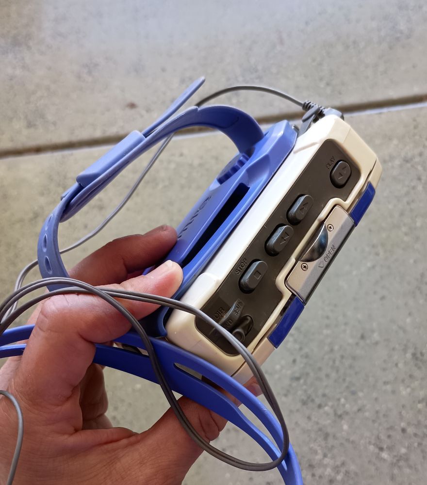 Purple and white cassette player with radio 