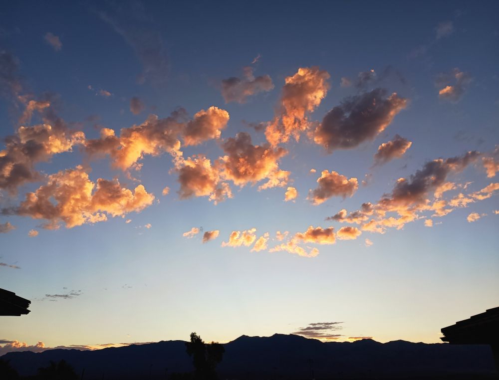 Pink clouds over the mountains at sunrise