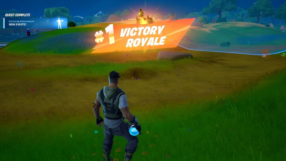 screenshot of a victory royale in fortnite. completed quest notification in left corner. 