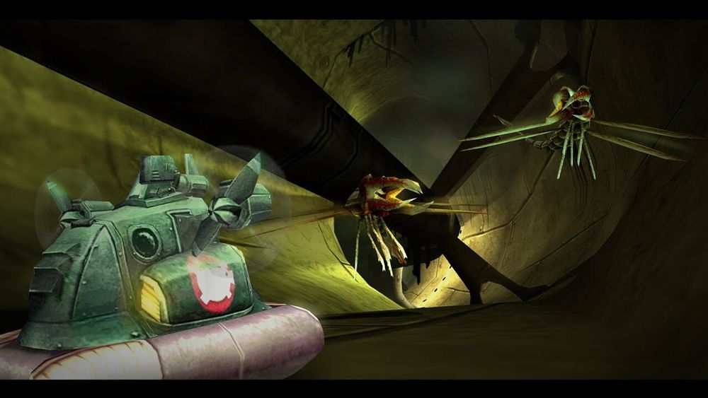 Screenshot from Beyond Good and Evil. At left is the player vehicle, a hovercraft made of green metal and a Grey inflation support. It has a pig logo on the side. Two flying insecticide creatures, nearly the size of the hovercraft, are at right. The scene is inside a gigantic metal pipe, with a huge bladed fan at the end. It is illuminated from behind 