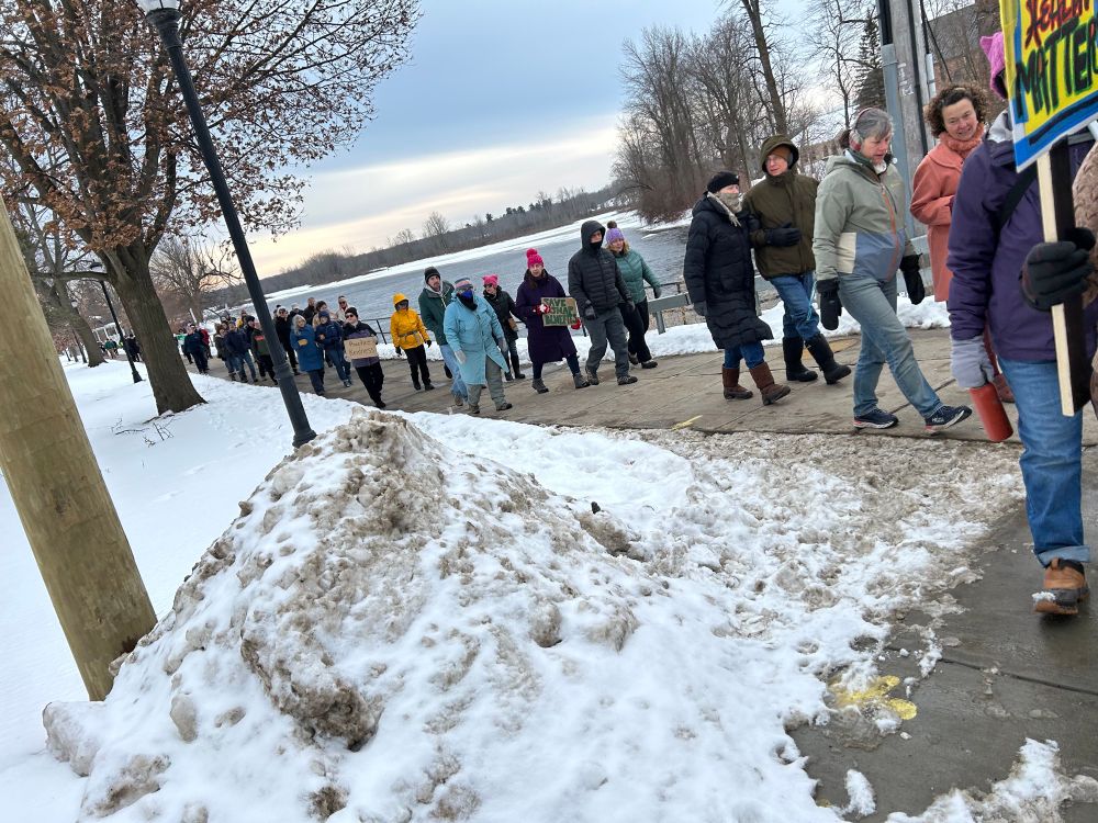 Potsdam Peoples March, people walking with protest signs