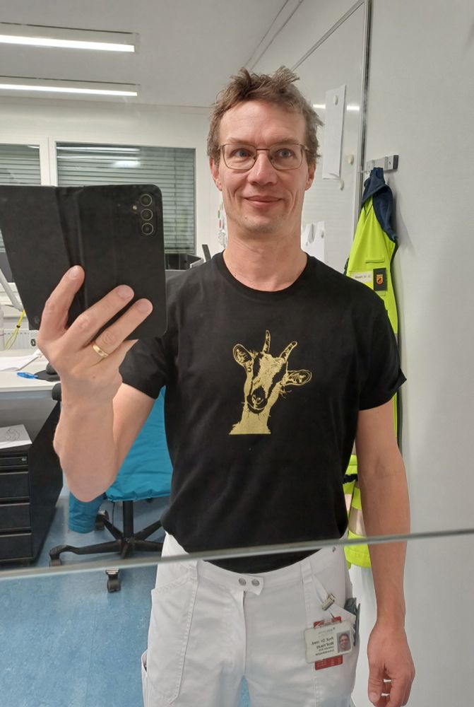 A golden goat on a black shirt