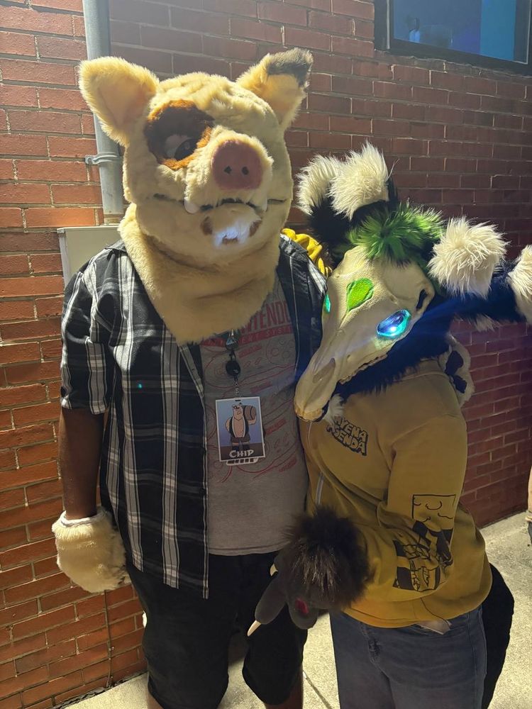A photo of Chip and Cringe both in fursuit.
