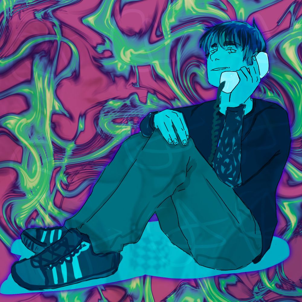 Awsten sitting with his legs up and talking on a phone.
