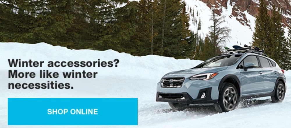 Photo of Subaru with text marketing winter accessories with a call to action of shop online. There's a metallic blue Subaru Crosstrek in snow on a mountain road in the background.