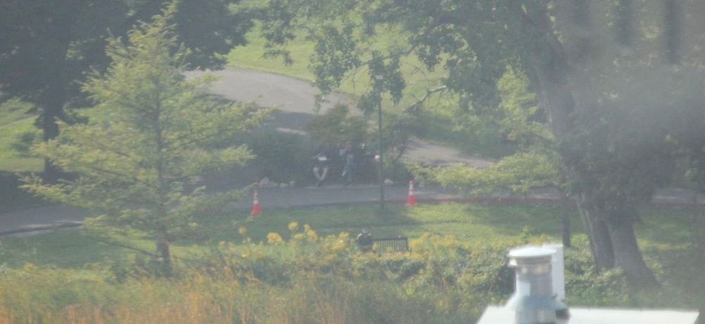 A distant, blurry photo of me and Sergy in a park