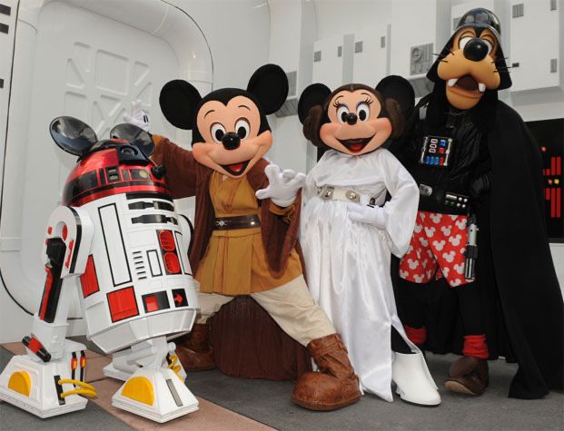Characters from Disney World's Star Wars Weekends: R2D2 with a red head and Mickey ears, Mickey Mouse as a Jedi, Minnie Mouse as Leia, and Goofy as Darth Vader with red boxer briefs with a white Mickey-shape pattern.